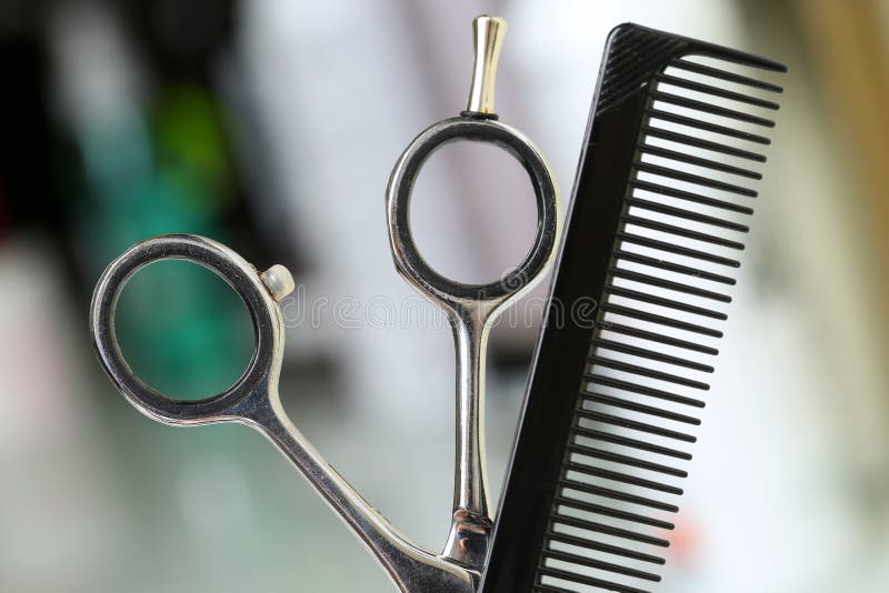 Barber instrument set in front of camera. Shiny steel scissors and comb ready to be used. Keratin restoration and repair, latest trend, fresh idea, tool store concept. Barber instrument set in front of camera. Shiny steel scissors and comb ready to be used. Keratin restoration and repair, latest trend, fresh idea, tool store concept