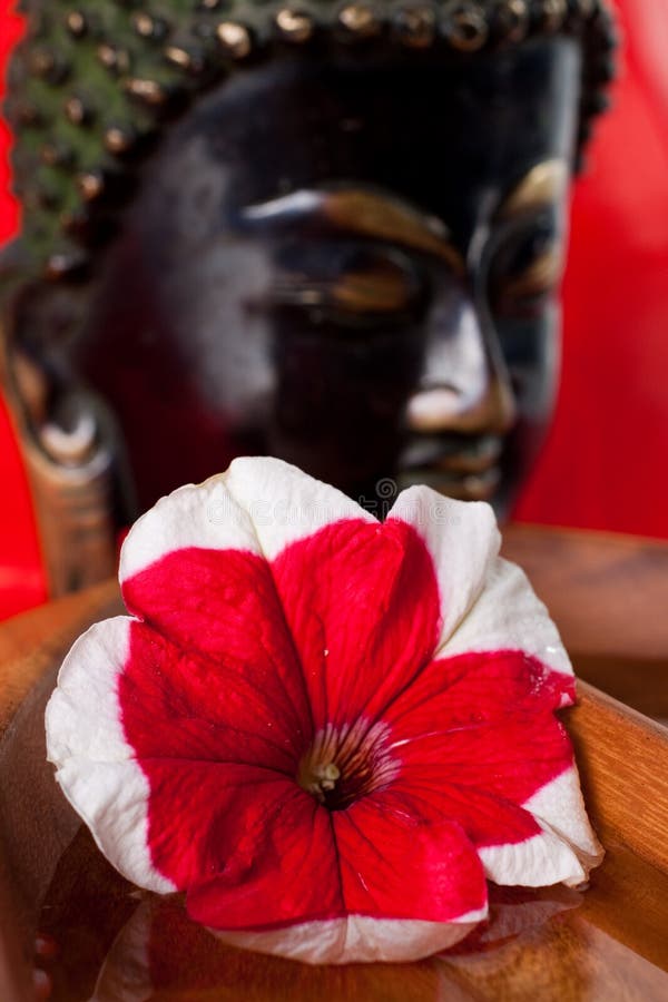 A Buddha statue in the background of this relaxing images. A Buddha statue in the background of this relaxing images