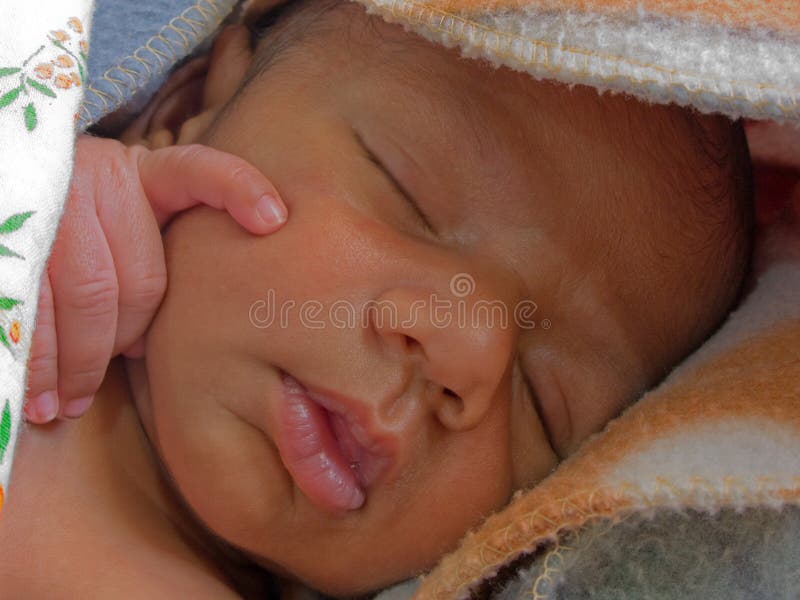 Photo of a baby pondering in his sleep. Photo of a baby pondering in his sleep