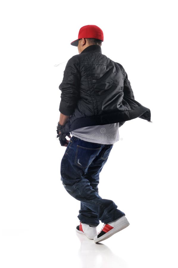 Hip-hop style dancer performing against a white background. Hip-hop style dancer performing against a white background