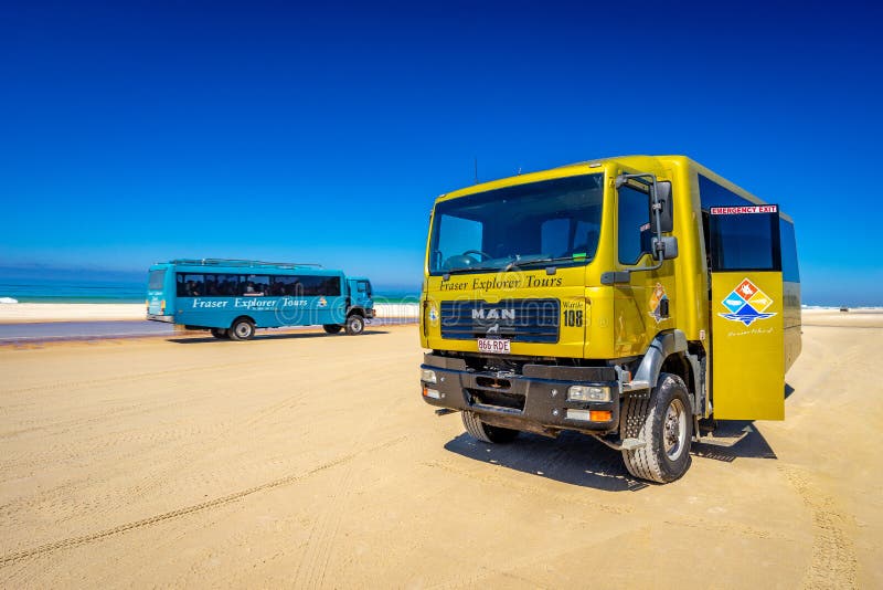 Fraser Explorer Tours buses on the 75 mile beach, Fraser Island, QLD, Australia. Fraser Explorer Tours buses on the 75 mile beach, Fraser Island, QLD, Australia.