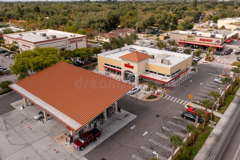 Miami, FL, USA - April 30, 2021: Wawa gas station and convenience store North Miami 163rd Street USA. Miami, FL, USA - April 30, 2021: Wawa gas station and convenience store North Miami 163rd Street USA