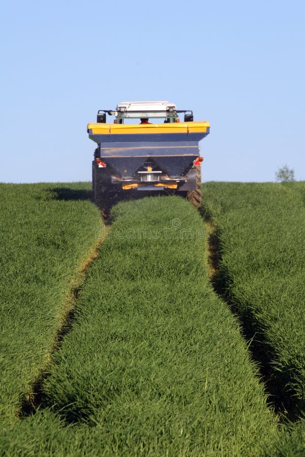 Farmers in the production of grass silage on a field. Farmers in the production of grass silage on a field