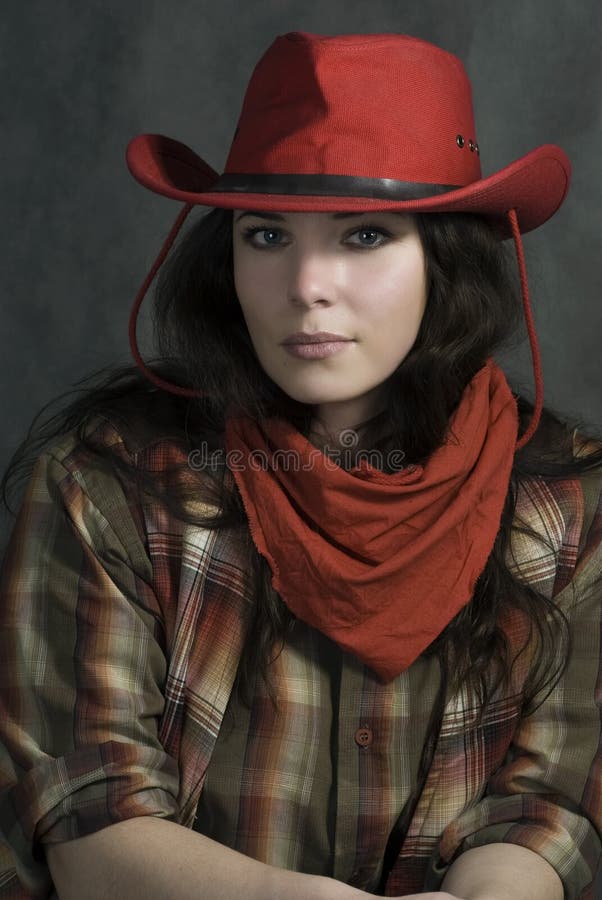 Portrait of a cowgirl in a hat. Western movie style. Portrait of a cowgirl in a hat. Western movie style