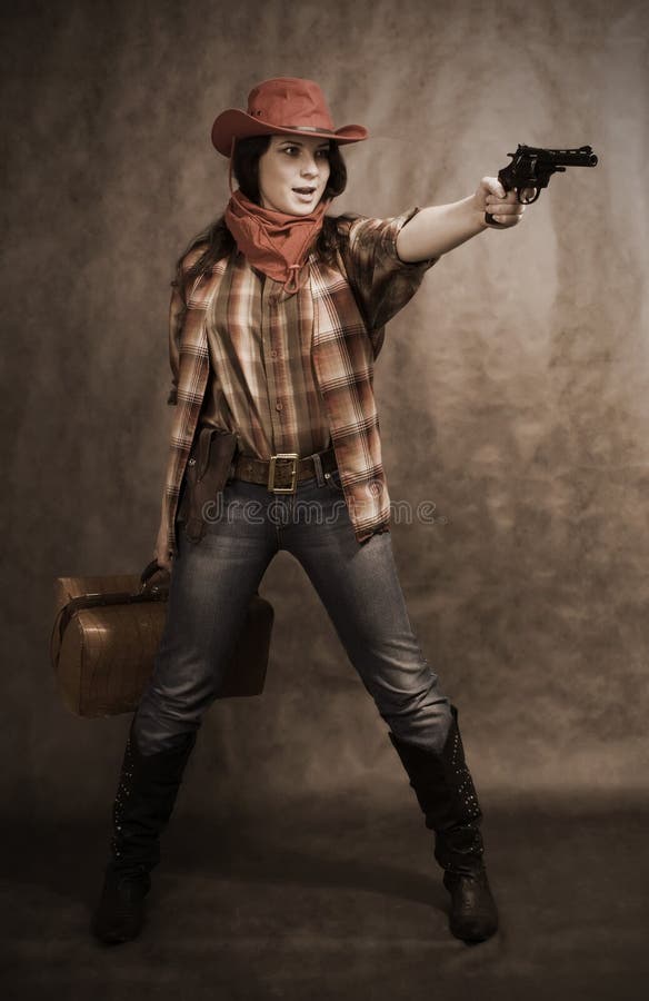 American cowgirl in a western movie style. American cowgirl in a western movie style