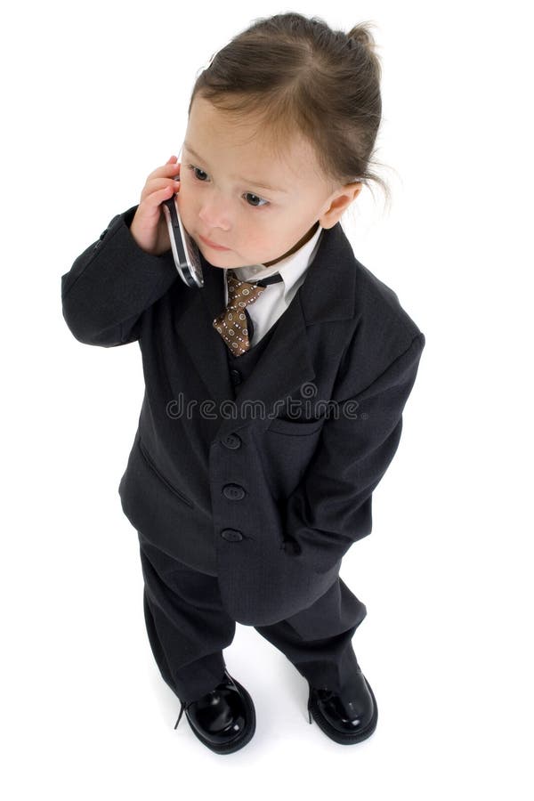 Japanese American 2 year old girl in suit with cellphone. Japanese American 2 year old girl in suit with cellphone.