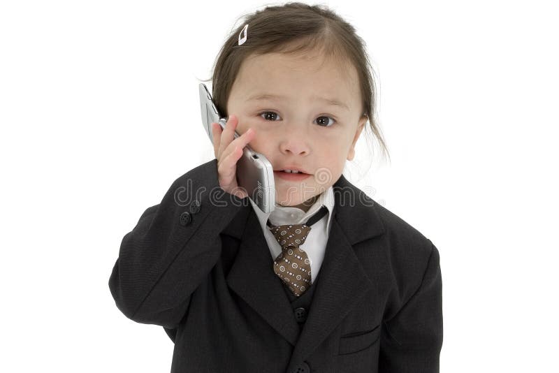 Japanese American 2 year old girl in suit with cellphone. Japanese American 2 year old girl in suit with cellphone.