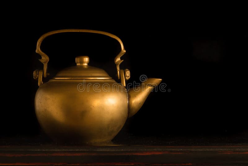 Antique Chinese Teapot isolated on black background. Antique Chinese Teapot isolated on black background