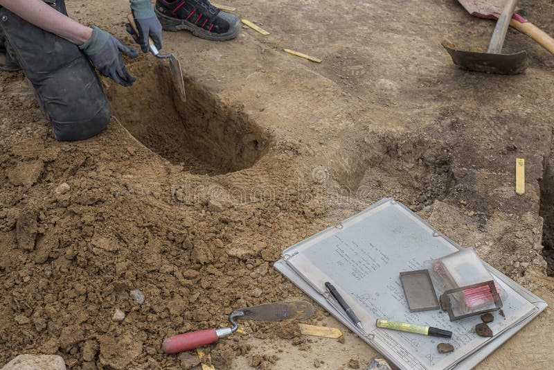 Archaeologist kneeling at an excavation in Erritsø of a Viking settlement, Erritsø, Denmark, June 15, 2022. Archaeologist kneeling at an excavation in Erritsø of a Viking settlement, Erritsø, Denmark, June 15, 2022