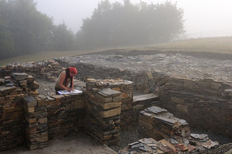 Archaeologist working in the Themal Baths of the Domus ( 1 st AD ) Archaeological site Chao Samartin Asturias SPAIN. Archaeologist working in the Themal Baths of the Domus ( 1 st AD ) Archaeological site Chao Samartin Asturias SPAIN