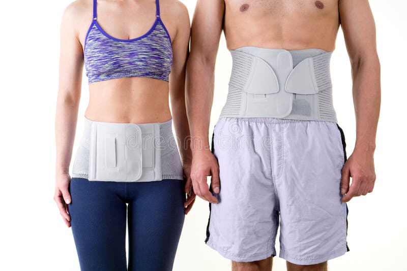 Detail of Mid Section of Athletic Man and Woman Wearing Supportive Orthopedic Back Braces for Lower Back, Standing Together in Studio with White Background. Detail of Mid Section of Athletic Man and Woman Wearing Supportive Orthopedic Back Braces for Lower Back, Standing Together in Studio with White Background