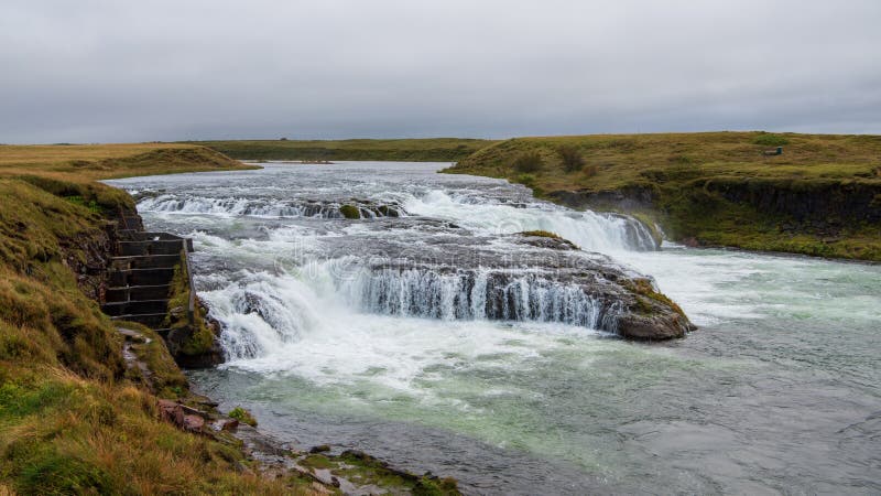 Ægissíõufoss is a waterfall of the Ytri-Rangá River in the southwest of Iceland, cascading down a V-shaped cropping of rock. A fish ladder has been constructed on the edge of the falls, aiding the river`s salmon population. Ægissíõufoss is a waterfall of the Ytri-Rangá River in the southwest of Iceland, cascading down a V-shaped cropping of rock. A fish ladder has been constructed on the edge of the falls, aiding the river`s salmon population