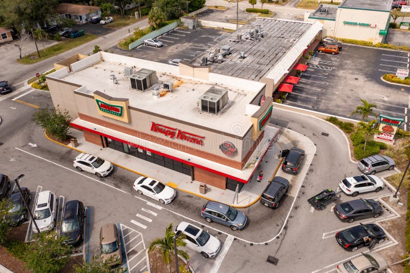 Miami, FL, USA - April 30, 2021: Aerial drone photo Krispy Kreme donut shop North Miami 163rd Street. Miami, FL, USA - April 30, 2021: Aerial drone photo Krispy Kreme donut shop North Miami 163rd Street