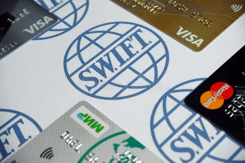 Russia, Moscow, 3.03.2022. Bank cards of Visa, Mastercard,MIR payment systems on a white background with the SWIFT logo