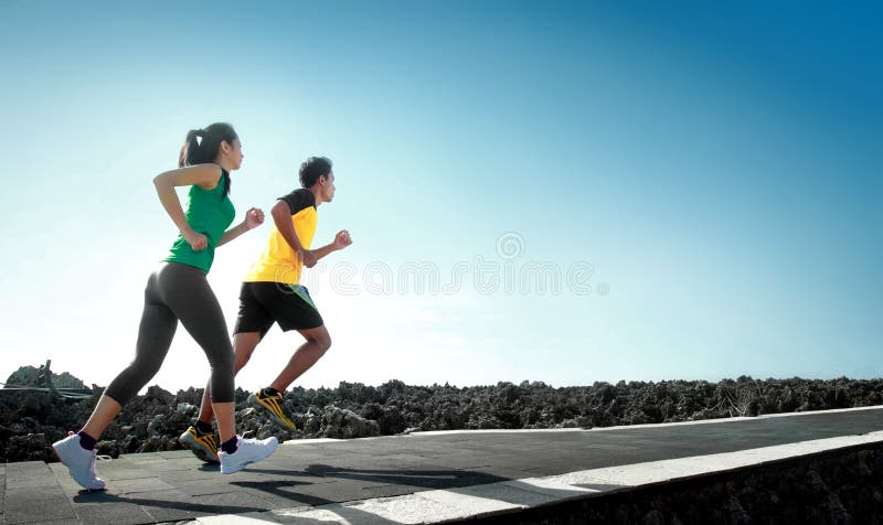 Sport - asian couple running outdoor doing exercise. Sport - asian couple running outdoor doing exercise