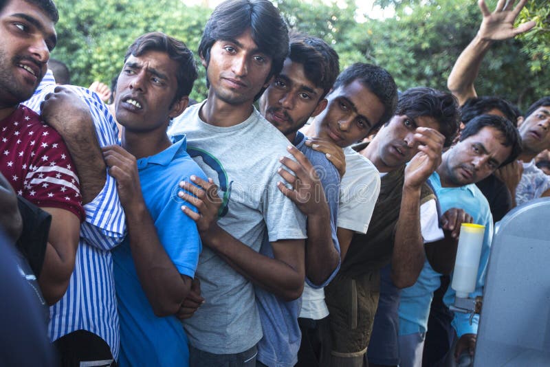 KOS, GREECE - SEP 27, 2015: Unidentified refugees. More than half are migrants from Syria, but there are refugees from other countries - Afghanistan, Pakistan, Iraq, Iran, Mali, Bangladesh, Eritrea. KOS, GREECE - SEP 27, 2015: Unidentified refugees. More than half are migrants from Syria, but there are refugees from other countries - Afghanistan, Pakistan, Iraq, Iran, Mali, Bangladesh, Eritrea.