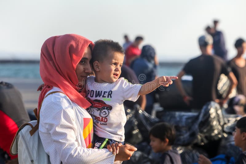 Thessaloniki, Greece â€“ Sept 2, 2019: Refugees and migrants disembark to the port of Thessaloniki after being transfered from the refugee camp of Moria, Lesvos island. Thessaloniki, Greece â€“ Sept 2, 2019: Refugees and migrants disembark to the port of Thessaloniki after being transfered from the refugee camp of Moria, Lesvos island