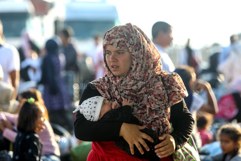 Thessaloniki, Greece â€“ Sept 2, 2019: Refugees and migrants disembark to the port of Thessaloniki after being transfered from the refugee camp of Moria, Lesvos island. Thessaloniki, Greece â€“ Sept 2, 2019: Refugees and migrants disembark to the port of Thessaloniki after being transfered from the refugee camp of Moria, Lesvos island