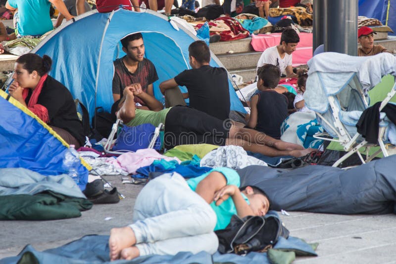 Refugees and migrants, most of them from Syria, are gathered at Keleti train station in Hungary, Sunday 30 august 2015. Thousands of syrian refugees are entering Hungary from Serbia, on their route to Germany. Refugees and migrants, most of them from Syria, are gathered at Keleti train station in Hungary, Sunday 30 august 2015. Thousands of syrian refugees are entering Hungary from Serbia, on their route to Germany.