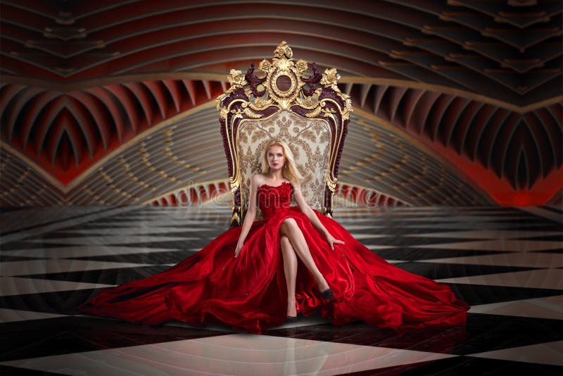 A woman in a luxurious gown dress sitting on a queen`s throne. A woman in a luxurious gown dress sitting on a queen`s throne