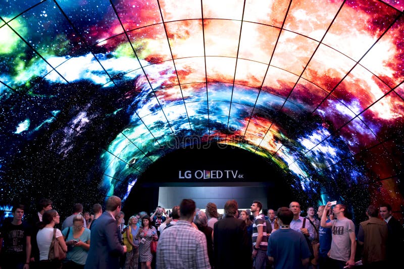 Crowds survey LG Oled TV tunnel on IFA Berlin. IFA Berlin is the worlds leading trade show for consumer electronics and home appliances. Crowds survey LG Oled TV tunnel on IFA Berlin. IFA Berlin is the worlds leading trade show for consumer electronics and home appliances.
