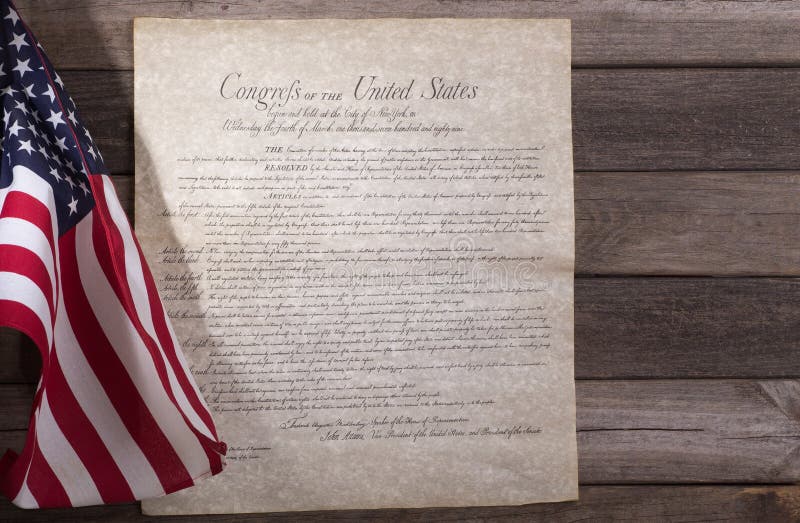 Bill of rights with United States flag on a wood background. Bill of rights with United States flag on a wood background