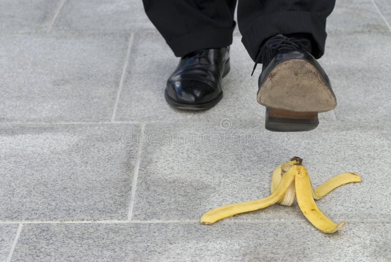 Businessman about to step on a banana skin, space for copy. Businessman about to step on a banana skin, space for copy.