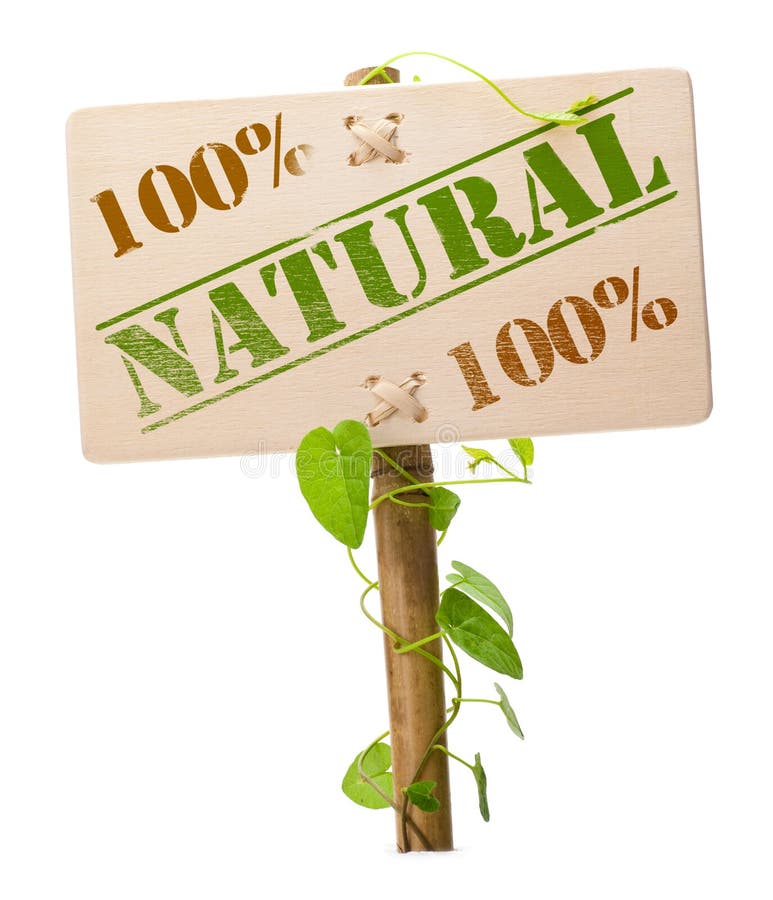 100 percent natural sign message on a wooden panel and green plant - image is isolated on a white background. 100 percent natural sign message on a wooden panel and green plant - image is isolated on a white background