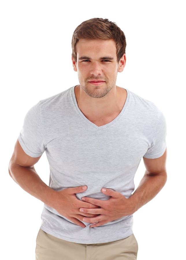 Stomach ache, pain and portrait of man on a white background with indigestion, hurt and injury. Health, sick and isolated person holding abdomen for nausea, belly problems and tummy cramps in studio. Stomach ache, pain and portrait of man on a white background with indigestion, hurt and injury. Health, sick and isolated person holding abdomen for nausea, belly problems and tummy cramps in studio.