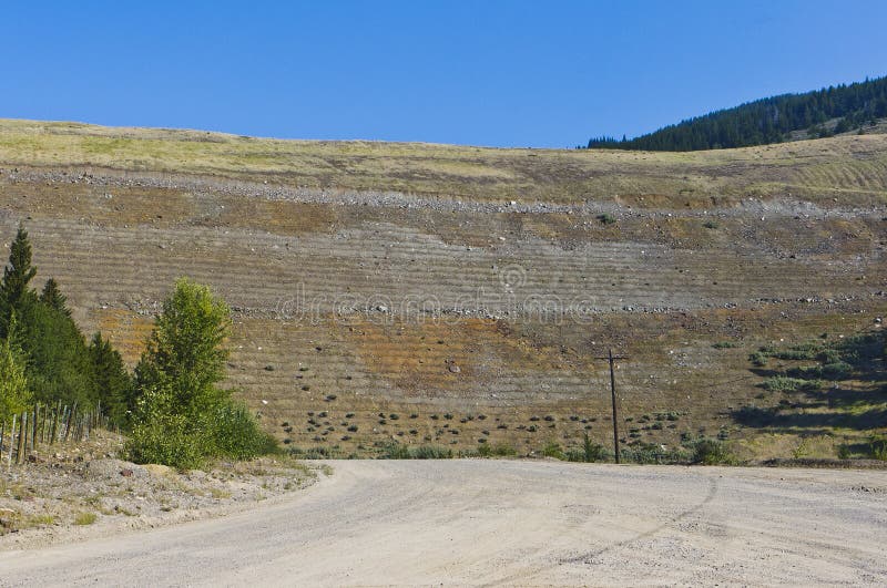 A large tailings pile under reclamation at the closed Barrick Nickle Plate mine in the interior of BC, Canada. A large tailings pile under reclamation at the closed Barrick Nickle Plate mine in the interior of BC, Canada.