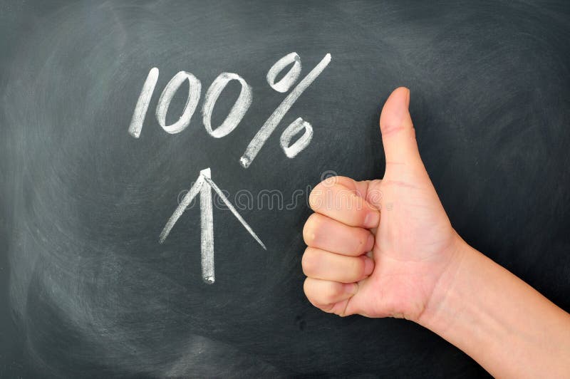 Thumb up with a 100 percent sign on a blackboard. Thumb up with a 100 percent sign on a blackboard