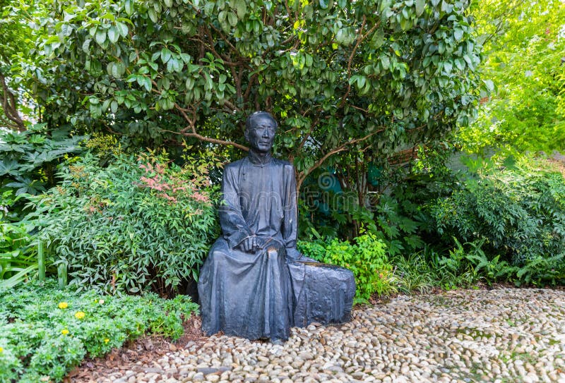 Bronze statue of Guo Moruo on Duolun Road, a pedestrian & cultural celebrity street in Hongkou, Shanghai, China. Famous Chinese archaeologist, historian, poet, politician & writer. Bronze statue of Guo Moruo on Duolun Road, a pedestrian & cultural celebrity street in Hongkou, Shanghai, China. Famous Chinese archaeologist, historian, poet, politician & writer.