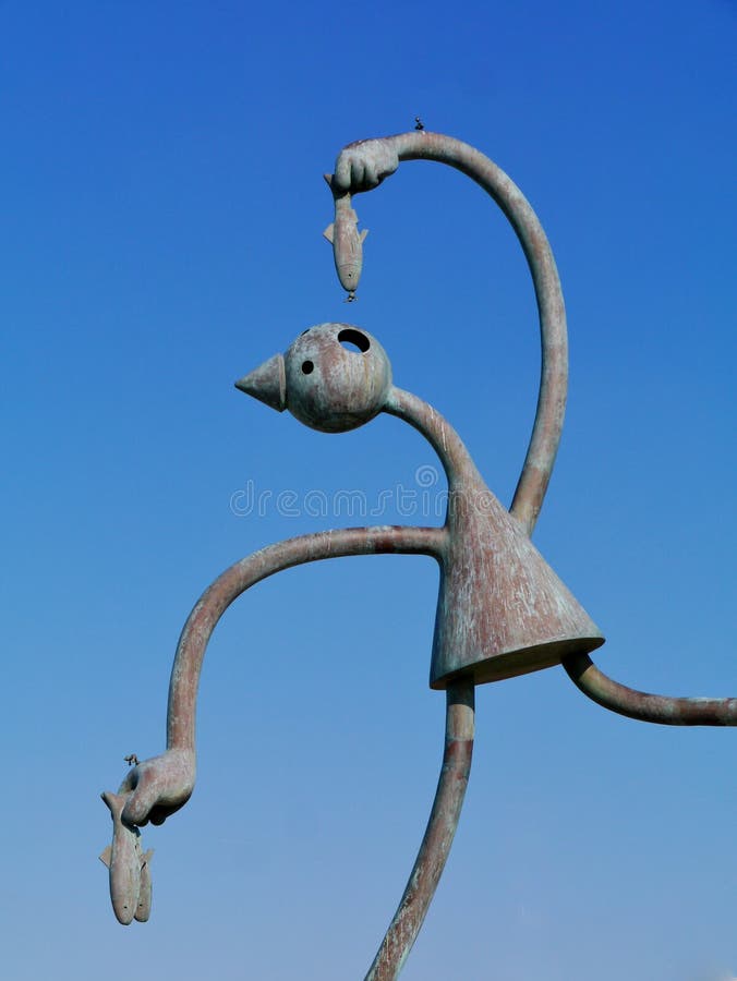 A statue of a herring eater at the Dutch coast in Scheveningen in the Netherlands. A statue of a herring eater at the Dutch coast in Scheveningen in the Netherlands