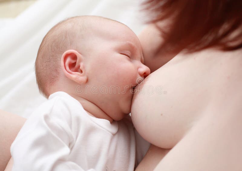 Mother breast-feeding her child, on a white background. Mother breast-feeding her child, on a white background
