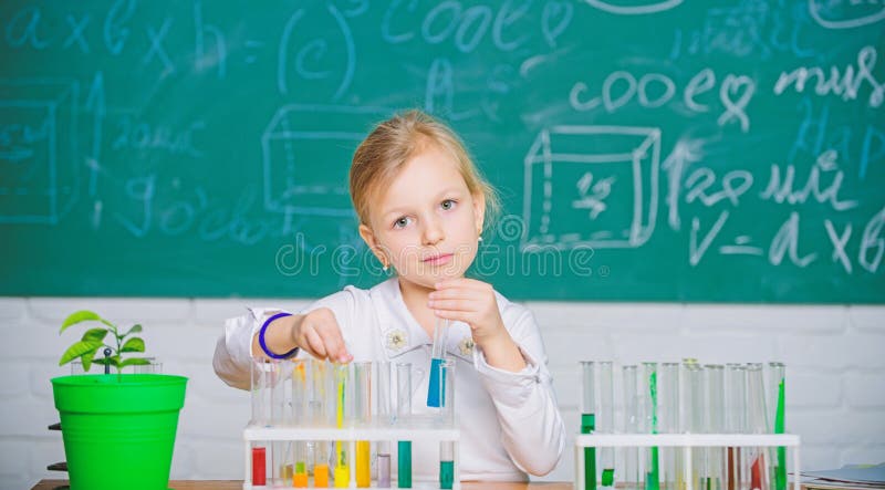 Future scientist. Explore and investigate. School lesson. Girl cute school pupil play with test tubes and colorful liquids. School chemical experiment. School education. Interesting approach to learn. Future scientist. Explore and investigate. School lesson. Girl cute school pupil play with test tubes and colorful liquids. School chemical experiment. School education. Interesting approach to learn.