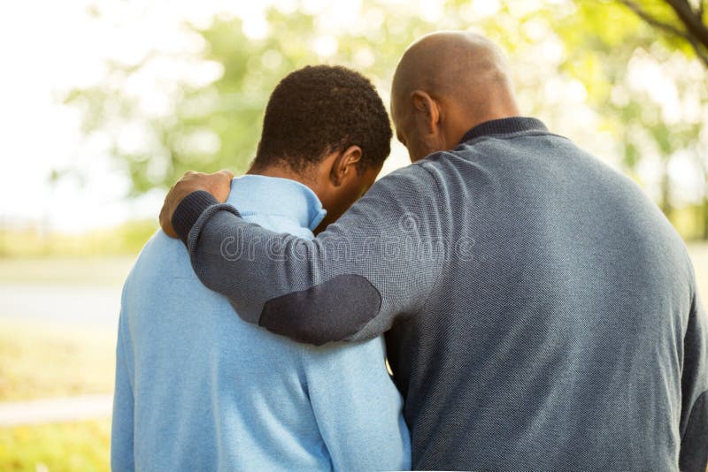 Father talking and spending time with his teenage son. Father talking and spending time with his teenage son.