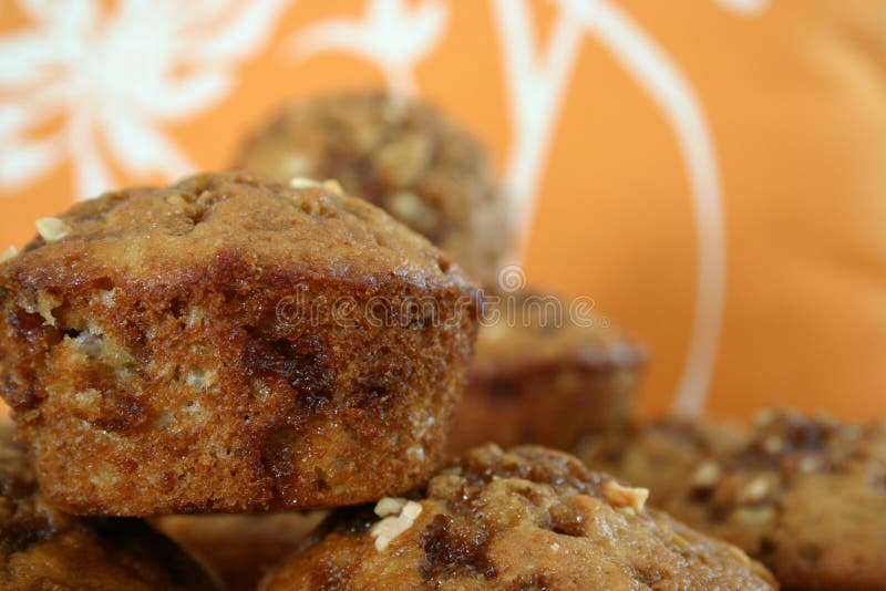 Banana-nut muffins placed on top of each other. Banana-nut muffins placed on top of each other