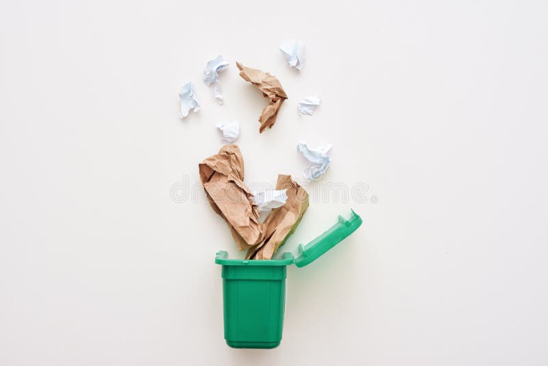 Sorting garbage concept. Paper trash. Crumple paper falling to the recycling bin. Sorting garbage concept. Paper trash. Crumple paper falling to the recycling bin