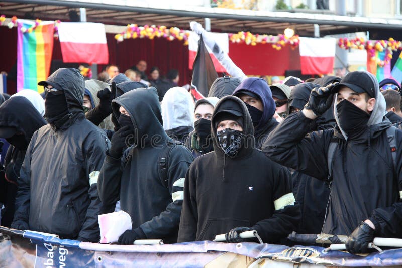 WARSAW, POLAND - NOVEMBER 11: The riots in the streets of Warsaw during the celebration of Independence Day on November 11, 2011 in Warsaw, Poland. WARSAW, POLAND - NOVEMBER 11: The riots in the streets of Warsaw during the celebration of Independence Day on November 11, 2011 in Warsaw, Poland.