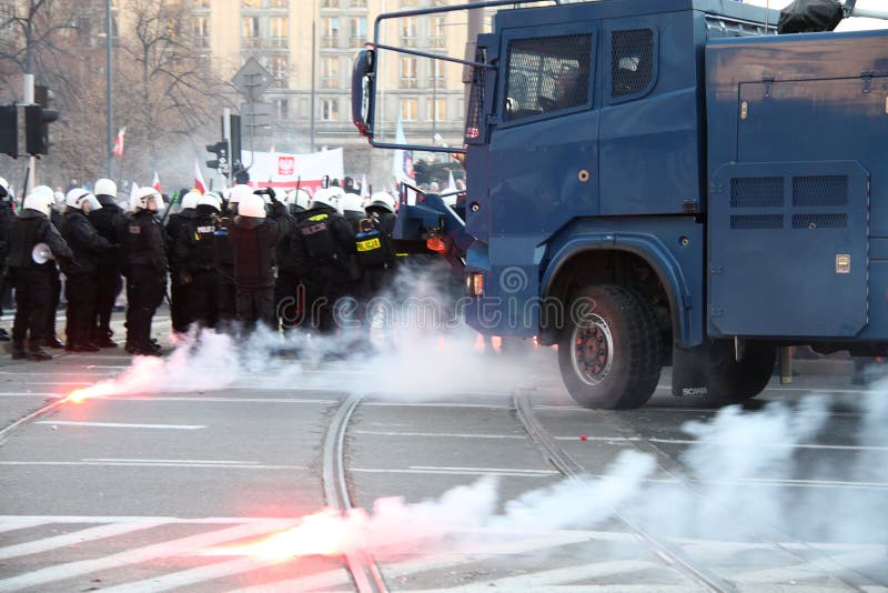 WARSAW, POLAND - NOVEMBER 11: The riots in the streets of Warsaw during the celebration of Independence Day on November 11, 2011 in Warsaw, Poland. WARSAW, POLAND - NOVEMBER 11: The riots in the streets of Warsaw during the celebration of Independence Day on November 11, 2011 in Warsaw, Poland.