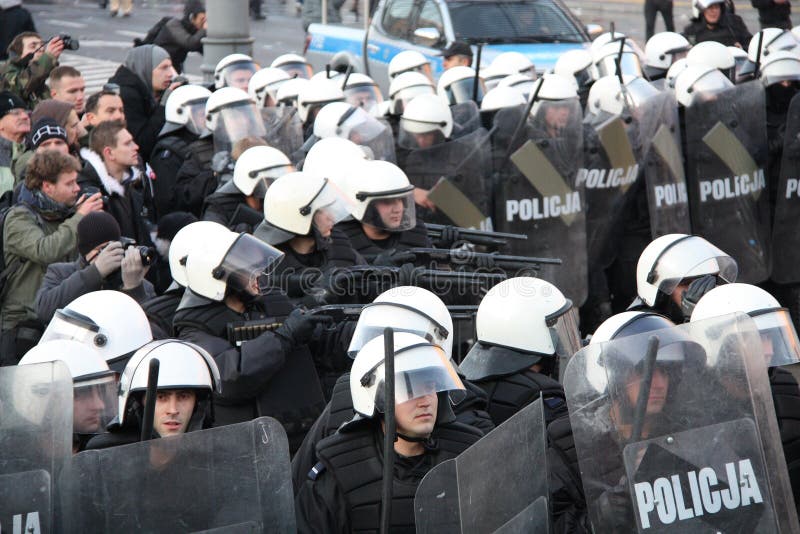 WARSAW, POLAND - NOVEMBER 11: The riots in the streets of Warsaw during the celebration of Independence Day on November 11, 2011 in Warsaw, Poland. WARSAW, POLAND - NOVEMBER 11: The riots in the streets of Warsaw during the celebration of Independence Day on November 11, 2011 in Warsaw, Poland.