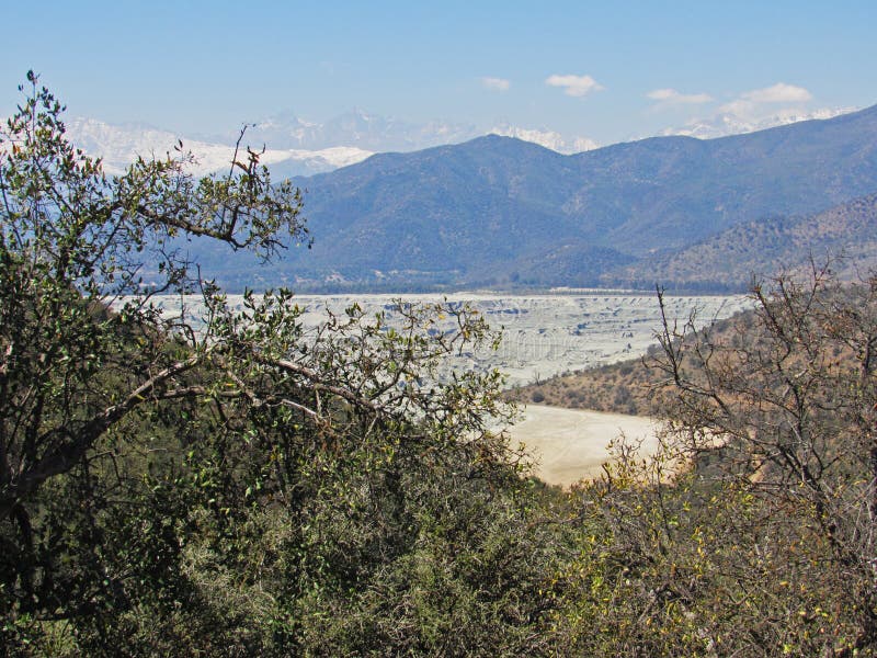 Landscape of copper mining tailings in the sclerophyllous forest of central Chile. This mediterranean ecosystem is one of the biodiversity hotspot worldwide. Landscape of copper mining tailings in the sclerophyllous forest of central Chile. This mediterranean ecosystem is one of the biodiversity hotspot worldwide.