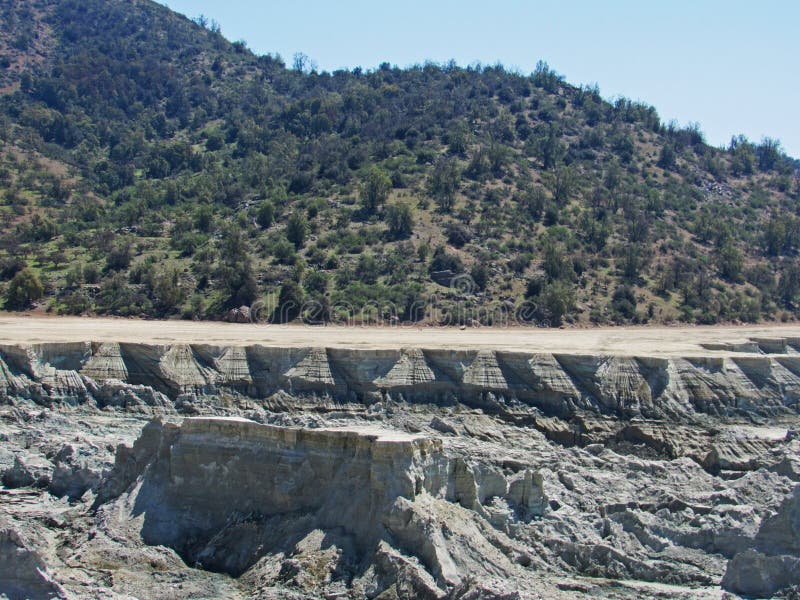 Landscape of copper mining tailings in the sclerophyllous forest of central Chile. This mediterranean ecosystem is one of the biodiversity hotspot worldwide. Landscape of copper mining tailings in the sclerophyllous forest of central Chile. This mediterranean ecosystem is one of the biodiversity hotspot worldwide.