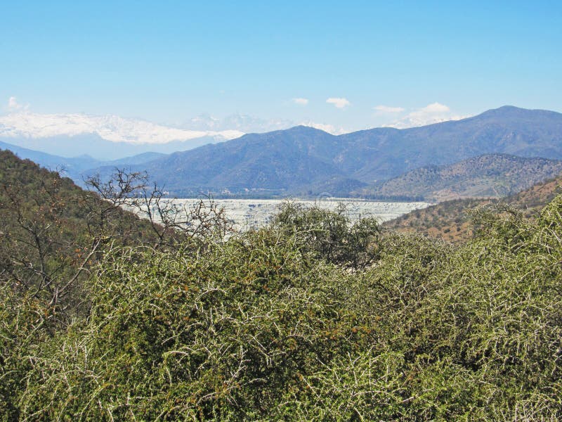 Landscape of copper mining tailings in the sclerophyllous forest of central Chile. This mediterranean ecosystem is one of the biodiversity hotspot worldwide. Landscape of copper mining tailings in the sclerophyllous forest of central Chile. This mediterranean ecosystem is one of the biodiversity hotspot worldwide.