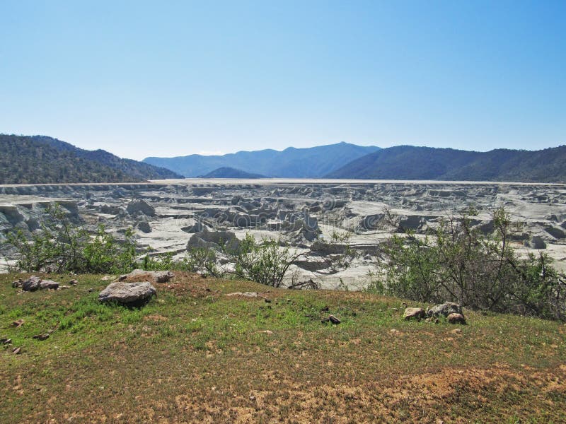 Landscape of copper mining tailings in the sclerophyllous forest of central Chile. This mediterranean ecosystem is one of the biodiversity hotspot worldwide. Landscape of copper mining tailings in the sclerophyllous forest of central Chile. This mediterranean ecosystem is one of the biodiversity hotspot worldwide.