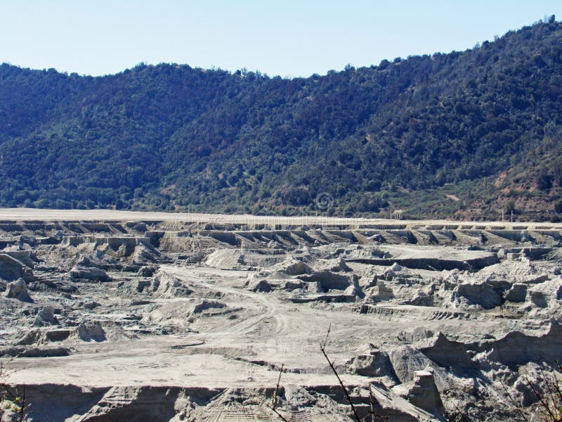 Landscape of copper mining tailings in the sclerophyllous forest of central Chile. This mediterranean ecosystem is one of the biodiversity hotspot worldwide. Landscape of copper mining tailings in the sclerophyllous forest of central Chile. This mediterranean ecosystem is one of the biodiversity hotspot worldwide.