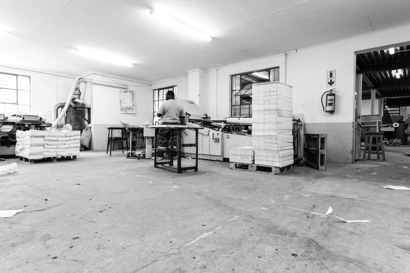 Middelburg, South Africa - February 2, 2015: Inside an empty Printing and Packaging Factory Facility. Middelburg, South Africa - February 2, 2015: Inside an empty Printing and Packaging Factory Facility