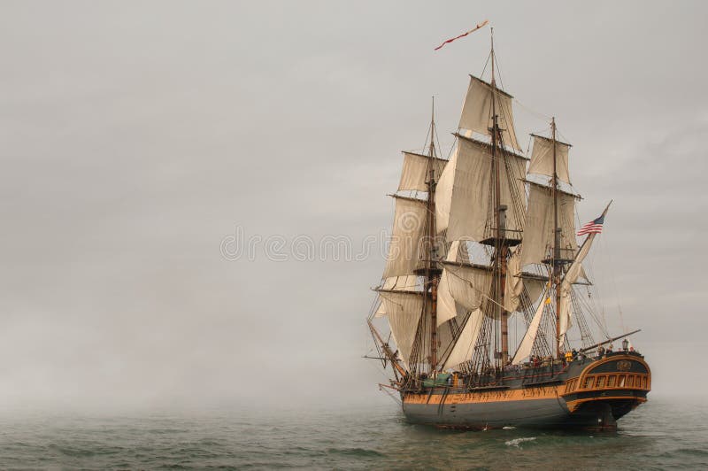 Vintage Frigate sailing into a fog bank. Vintage Frigate sailing into a fog bank