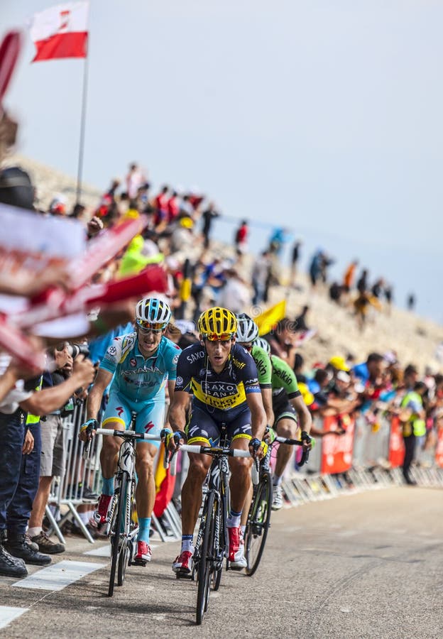 Mont Ventoux, France- July 14 2013: Group of cyclists including the Czech Roman Kreuziger (Team Saxo-Tinkoff) and the Danish Jakob Fuglsang (Astana Team), climbing the last kilometer of the ascension to Mont Ventoux during the stage 15 of the 100 edition of Le Tour de France 2013. Mont Ventoux, France- July 14 2013: Group of cyclists including the Czech Roman Kreuziger (Team Saxo-Tinkoff) and the Danish Jakob Fuglsang (Astana Team), climbing the last kilometer of the ascension to Mont Ventoux during the stage 15 of the 100 edition of Le Tour de France 2013.