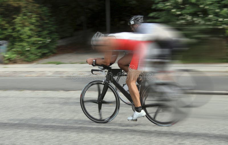 Two bike race cyclists racing at high speed on road with dynamic motion blur. Two bike race cyclists racing at high speed on road with dynamic motion blur